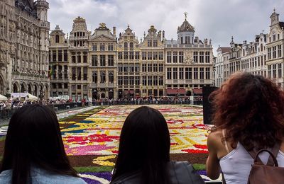 Rear view of people in city