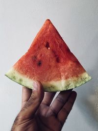 Close-up of hand holding fruit