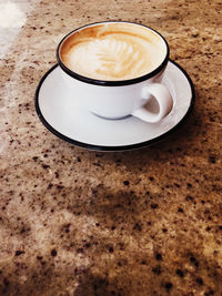 Close-up of cappuccino on table