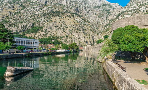 Scenic view of river with mountain in background