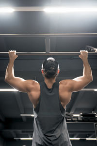 Low angle view of male athlete exercising in gym