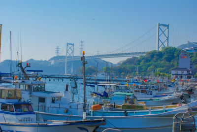 Boats moored at harbor