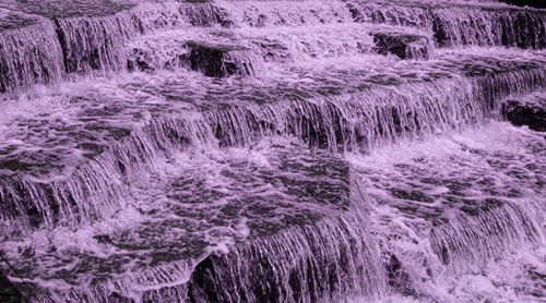 Full frame shot of water flowing through rocks