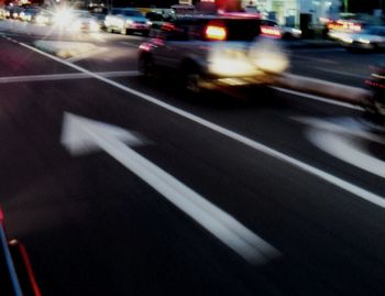 Blurred motion of cars on road at night