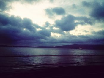 Scenic view of sea against cloudy sky