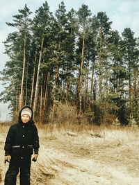 Portrait of man standing on field