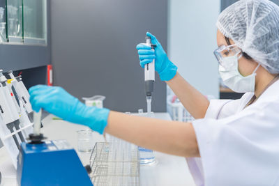 Scientist examining chemical in laboratory