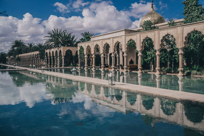 Reflection of palm trees in swimming pool