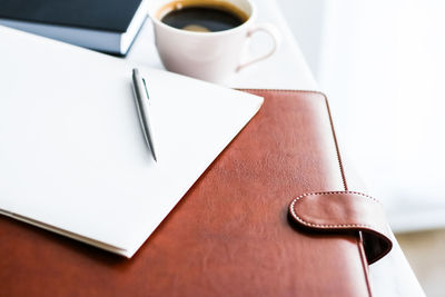 High angle view of laptop and book on table