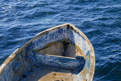 Abandoned boat on sea