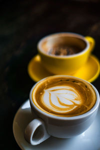 Close-up of coffee cup on table