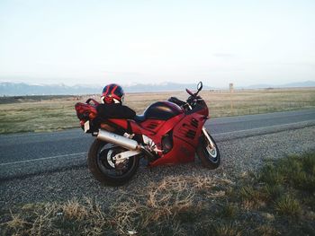 Motorcycle on road against sky