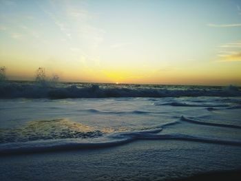 Scenic view of snow covered landscape at sunset