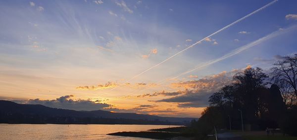 Scenic view of silhouette mountains against sky at sunset