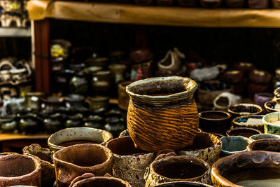 Various containers for sale at market stall