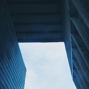 Low angle view of bridge against blue sky