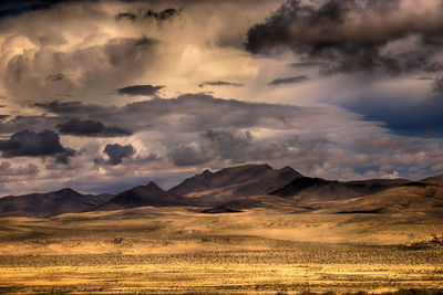 Scenic view of landscape against cloudy sky