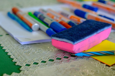 Close-up of multi colored pencils on table