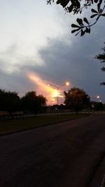 Road against cloudy sky at sunset