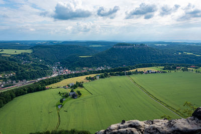 Scenic view of agricultural field against sky