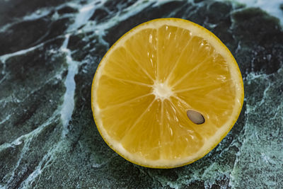 High angle view of lemon on marble