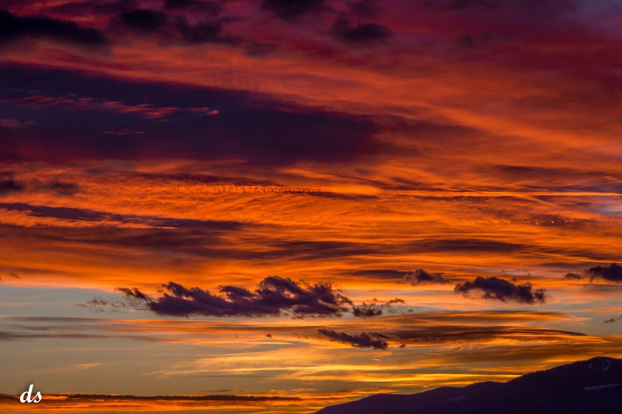 SCENIC VIEW OF MOUNTAINS AGAINST DRAMATIC SKY