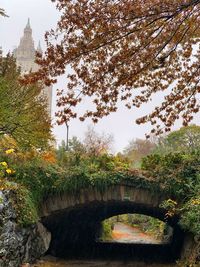 Bridge over canal against sky