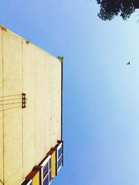 Low angle view of building against clear blue sky