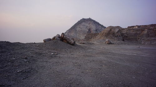 Rock formations in desert against sky