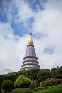 View of temple building against cloudy sky