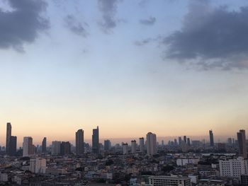 Cityscape against sky during sunset