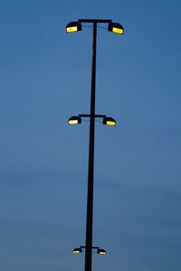 Low angle view of street light against sky