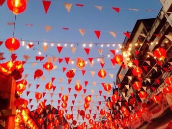 Illuminated lanterns hanging at night