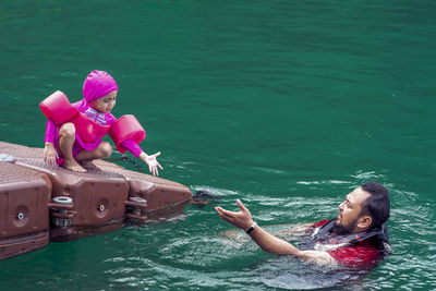 Father and daughter in lake