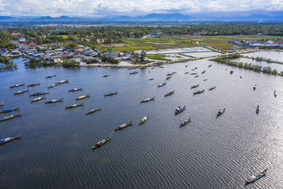 High angle view of land and sea against sky