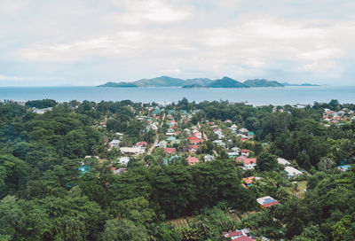 High angle view of trees and buildings against sky