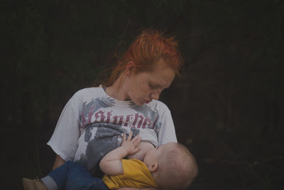 Close-up of mother breastfeeding baby 