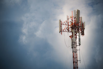 Low angle view of communications tower against sky