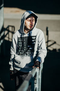 Portrait of young man standing outdoors