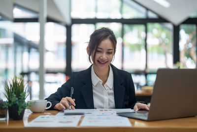 Portrait of businesswoman working at office