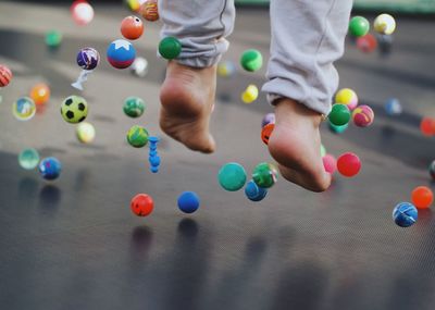 Low section of man playing with ball