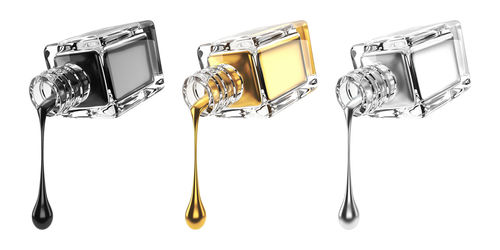 Directly above shot of metal equipment against white background