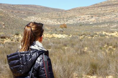 Rear view of woman looking at landscape