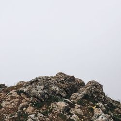 Low angle view of mountain against clear sky