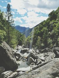 Scenic view of mountain against cloudy sky