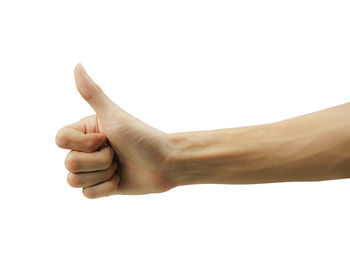 Close-up of human hand against white background