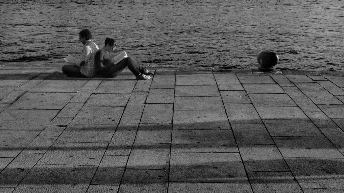 sitting, water, two people, relaxation, full length, real people, nature, day, outdoors, sea, togetherness, men, young adult, people