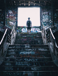 Low angle view of man on staircase