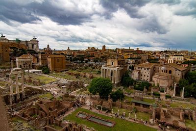 High angle view of roman ruins against cloudy sky