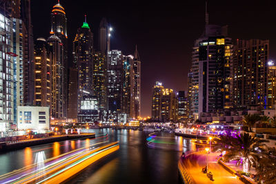 Illuminated modern buildings in city at night